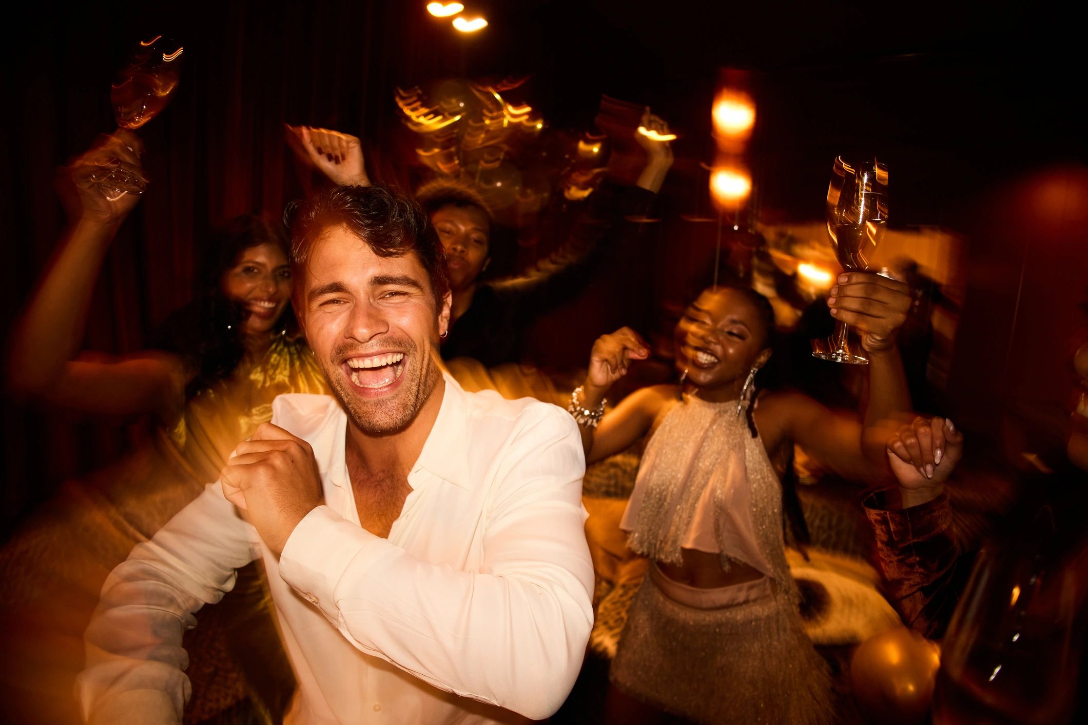 Guests dancing and celebrating at a lively nightlife event